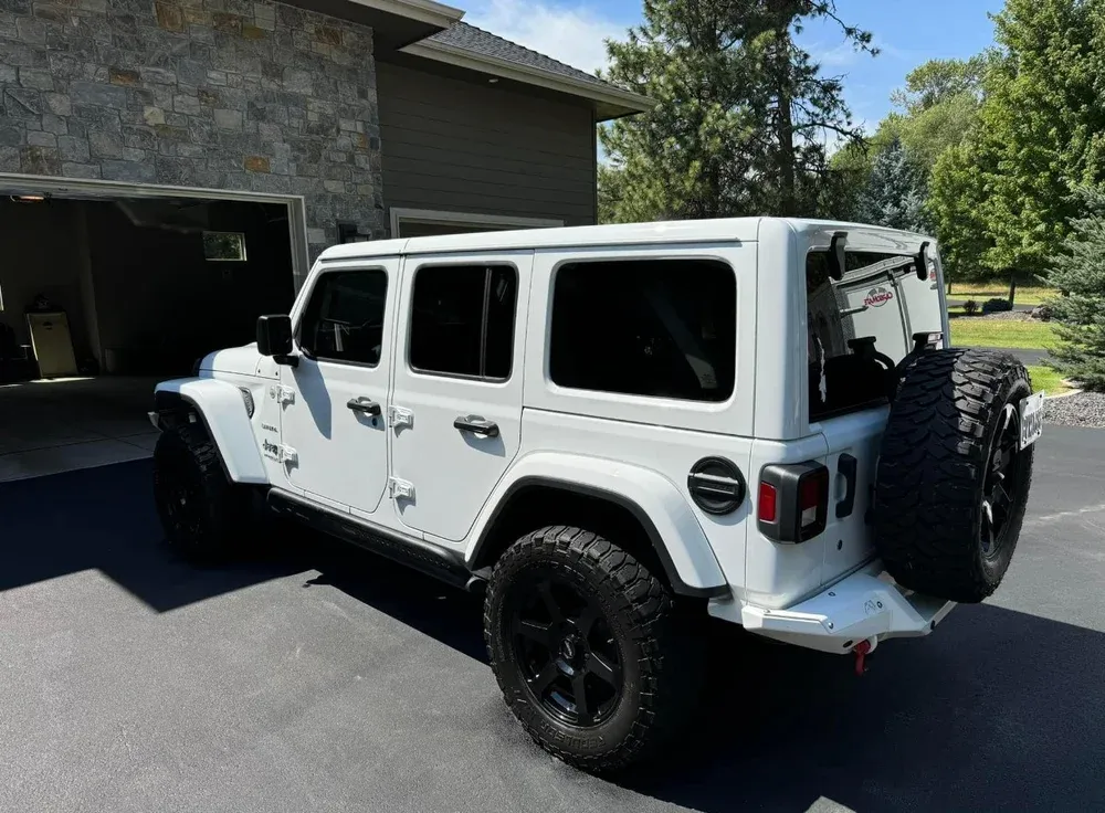 Freshly detailed Jeep Wrangler parked in a driveway
