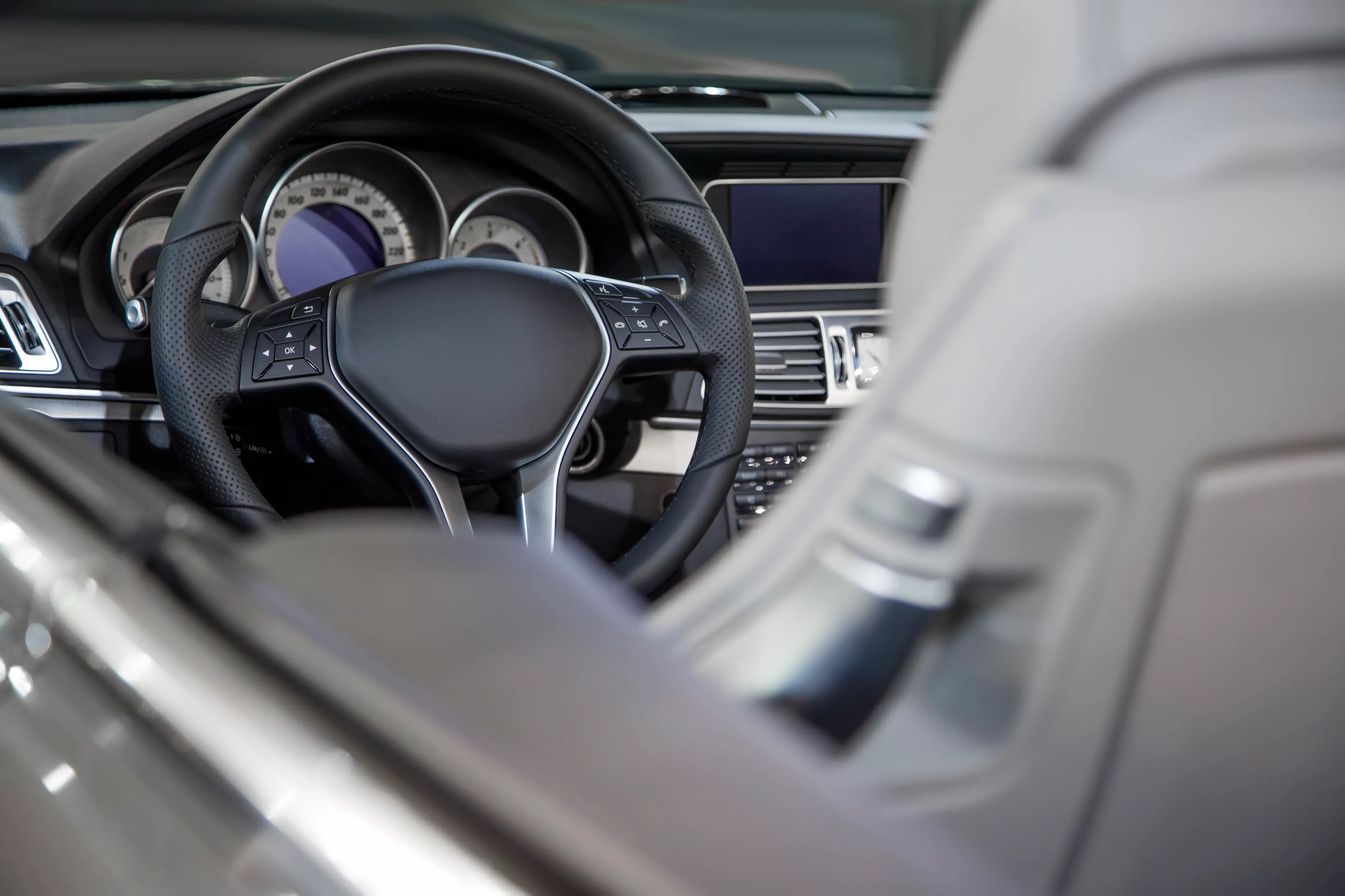 Detailed vehicle interior, steering wheel and dashboard